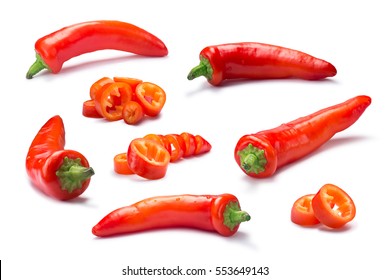Set of whole and chopped orange Hungarian Hot Wax pepper or paprika (Capsicum annuum). Clipping path for each pepper, shadows separated