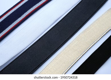 A Set Of Wide Elastic Bands For A Belt And Suspenders. Decorative Elastic Bands For Sewing Dresses, Trousers, Skirts. Textile Elastic Bands For A Belt In Different Colors.