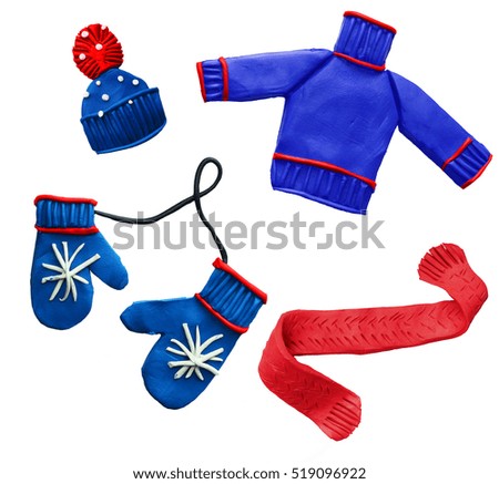 set of winter clothes made by hand from the plastic mass. sweater, scarf, hat, mittens