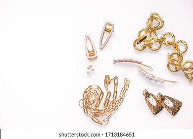set of woman gold jewelry on a white background, hairpins, chain, pearls - Shutterstock ID 1713184651
