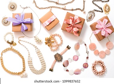 Set of women's jewelry in vintage style necklace cameo pearl bracelet chain earrings on white background. The view from the top lay flat. - Shutterstock ID 1099837652