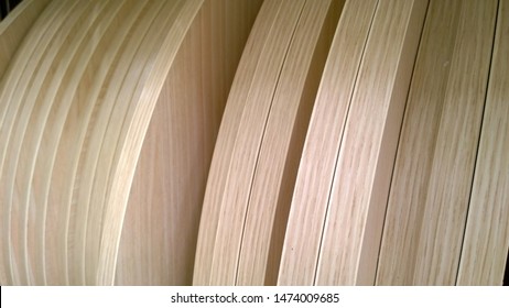 A set of wooden boards for the manufacture of furniture.  Interior design concept.  Beige natural background. Production of products from environmentally friendly materials for the home and garden