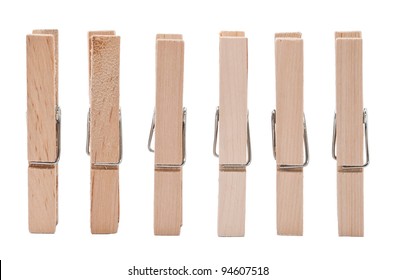 Set of wooden clothes pins on white background