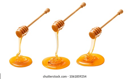 Set of wooden dippers with dripping honey isolated on white background. Package design element - Powered by Shutterstock