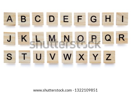 Set of wooden English alphabet blocks with letters - isolated on white background with clipping path.