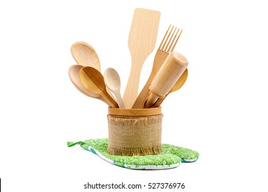 Set of wooden kitchen utensils isolated on white background.