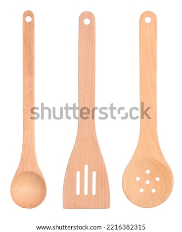 Set of wooden spoons with long handle, ladle, slotted spatula and straining skimmer isolated on white background
