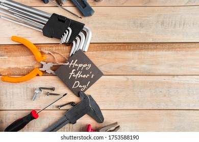 Set of work tools on a wooden background. Festive greeting card concept for Father's day - Shutterstock ID 1753588190