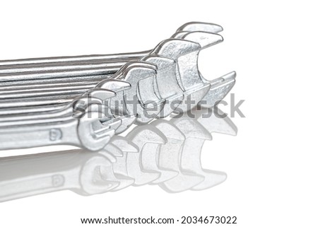 A set of wrenches from small to large size, selective focus, close-up, isolated on a white background