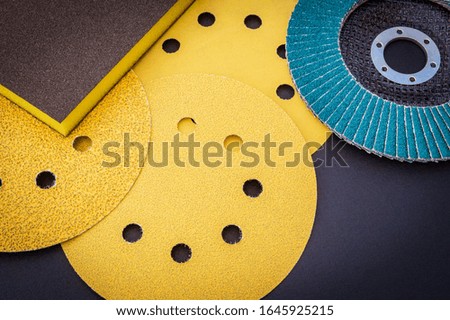 Set of yellow abrasive tools on black background. The wizard is used for grinding items