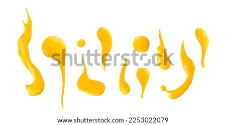 Set of yellow drops and splashes of cheese sauce or mustard isolated on white background. With clipping path. Full depth of field. Focus stacking. 