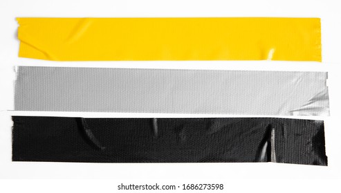 Set of yellow, gray, black tapes on white background. Torn horizontal and different size sticky tape, adhesive pieces.