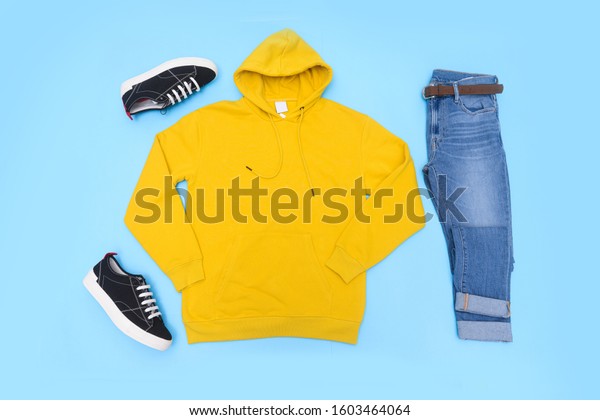 yellow hoodie black jeans