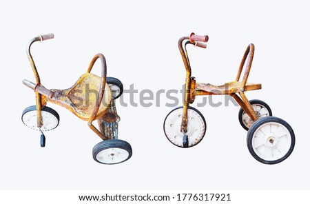 Set of yellow rusty kids tricycle isolated on white background.