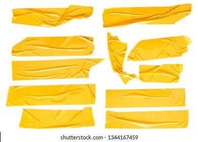 Набор желтых лент на белом фоне. Рваная горизонтальная и разного размера желтая липкая лента, клейкие кусочки.
