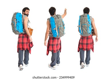 Set Of Young Backpacker Walking Over White Background