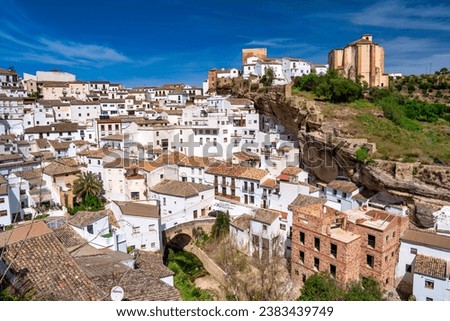 Setenil de las Bodegas. Typical Andalucian village with white houses and sreets with dwellings built into rock overhangs above Rio Trejo.
