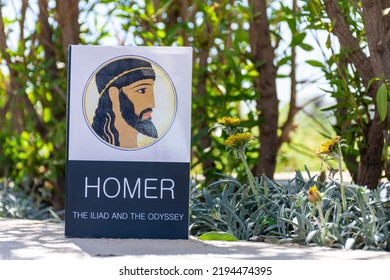 Setif, Algeria - August 24, 2022: Close Up Homer's  Iliad  Odyssey Book In The Garden.