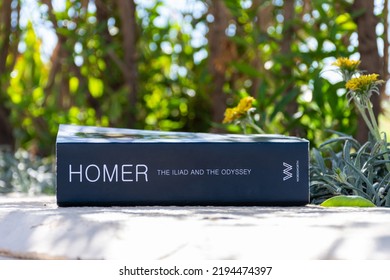 Setif, Algeria - August 24, 2022: Close Up Homer's  Iliad  Odyssey Book In The Garden.