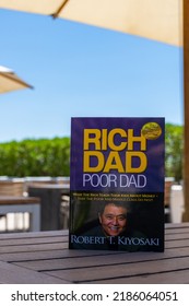 Setif, Algeria - June 9, 2021: Close Up Robert Kiyosaki And Sharon Lechter's Rich Dad Poor Dad Book On A Wooden Table. Entrepreneurship Concept.