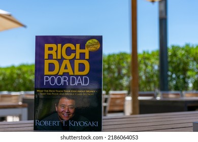 Setif, Algeria - June 9, 2021: Close Up Robert Kiyosaki And Sharon Lechter's Rich Dad Poor Dad Book On A Wooden Table. Entrepreneurship Concept.