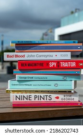 Setif, Algeria - October 24, 2021: Close Up A Stack Of Books On The Wooden Table Outside. New Arrivals Books Concept.