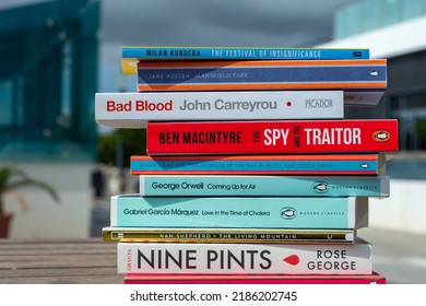 Setif, Algeria - October 24, 2021: Close Up A Stack Of Books On The Wooden Table Outside. New Arrivals Books Concept.