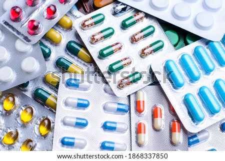 Sets of pills of different colour, size and shape. Medicine, treatment, pharmacy concept.