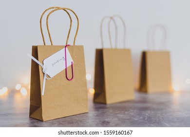 setting the best price for a product conceptual still-life, shopping bags lined up and one with tag with Pricing text on it with bokeh and fairy lights - Shutterstock ID 1559160167