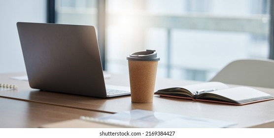 Setting Up For A Busy Day Ahead. Shot Of A Neatly Arranged Work Station In A Modern Office.