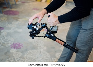 Setting up the camera, the operator's work with the sdedicam, the camera stabilizer, the equipment for shooting video, the picture balancer. High quality photo