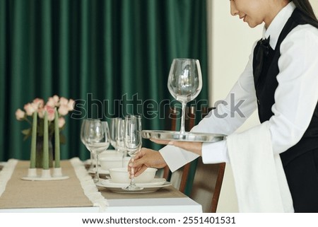 Setting Up Elegant Dining Table for Formal Event