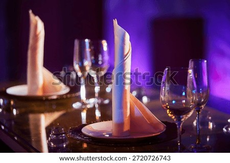 The setting of the festive table is illuminated.