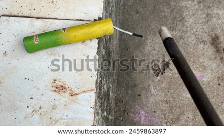 Setting fire to a small bomb