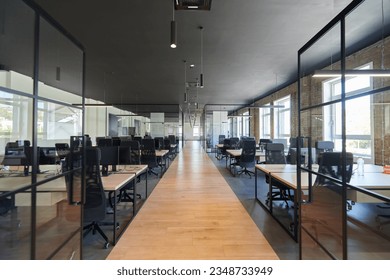 In a setting of modern, glass-walled business startup offices, the open, airy workspace reflects a contemporary and innovative ambiance, promising a dynamic environment for entrepreneurial growth - Powered by Shutterstock