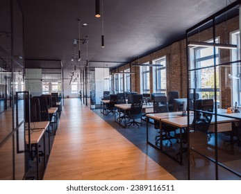 In a setting of modern, glass-walled business startup offices, the open, airy workspace reflects a contemporary and innovative ambiance, promising a dynamic environment for entrepreneurial growth