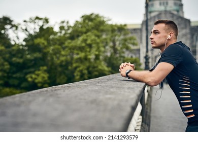 Setting New Goals For Himself. Shot Of A Sporty Young Man Taking A Break While Exercising Outdoors.