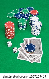 A Setting Of A Poker Game Shows Cards Down And Bet Placed On Top Of The Cards.