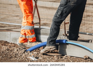 Setting road border kerb stone before laying new asphal