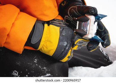 Setting Up Ski Equipment, Close-up Of A Hand For Setting Up And Twisting Ski Boot Bindings On A Mountain In The Snow