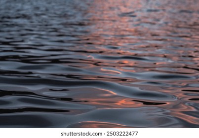 Setting sun abstract water wave reflection, natural landscape background, golden hour, selective focus - Powered by Shutterstock