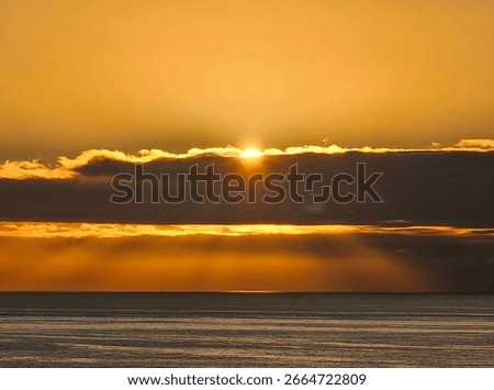 Setting Sun Battling Clouds for Our Attention