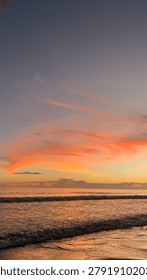 The setting sun is hidden behind the clouds, but its beautiful glow will never go unnoticed on the horizon