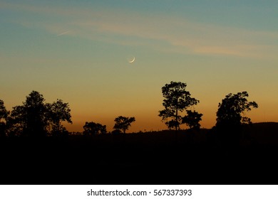 The setting sun and the moon.
