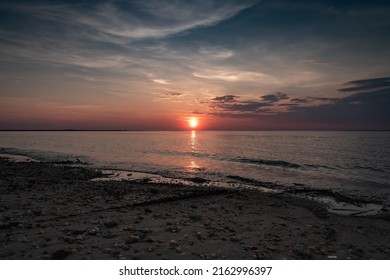 Setting Sun Over The Delaware Bay.