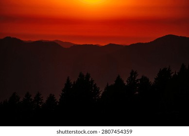 Setting Sun over Mountain Range