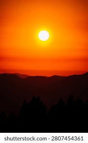 Setting Sun over Mountain Range