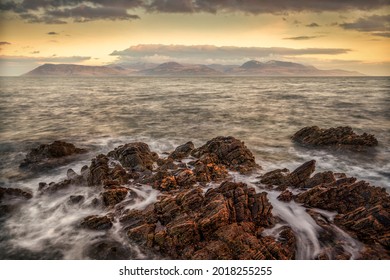 Setting sunlight on the Isle of Arran from the Mull of Kintyre