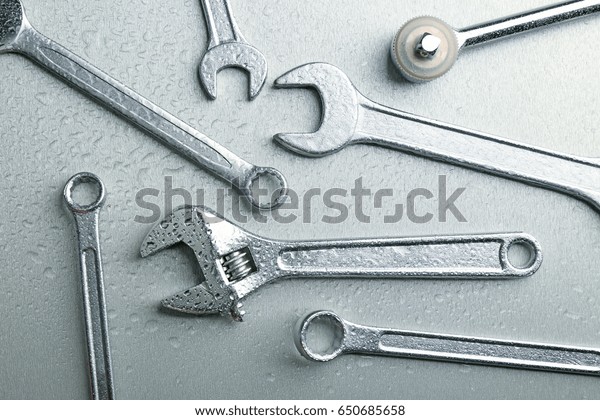Setting of\
tools for car repair on light\
background