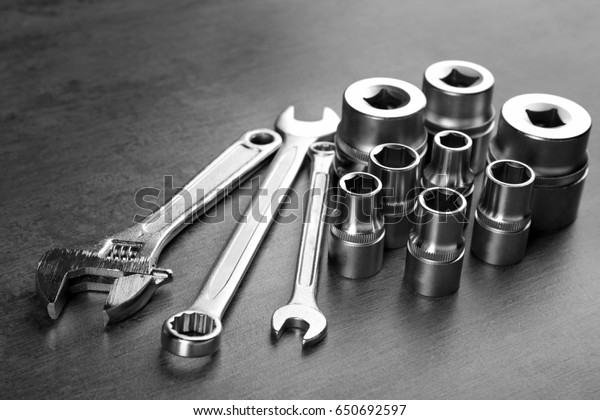 Setting of tools\
for car repair on grey\
table